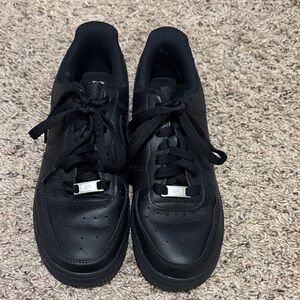 Nike black Air Force 1 low tennis shoes